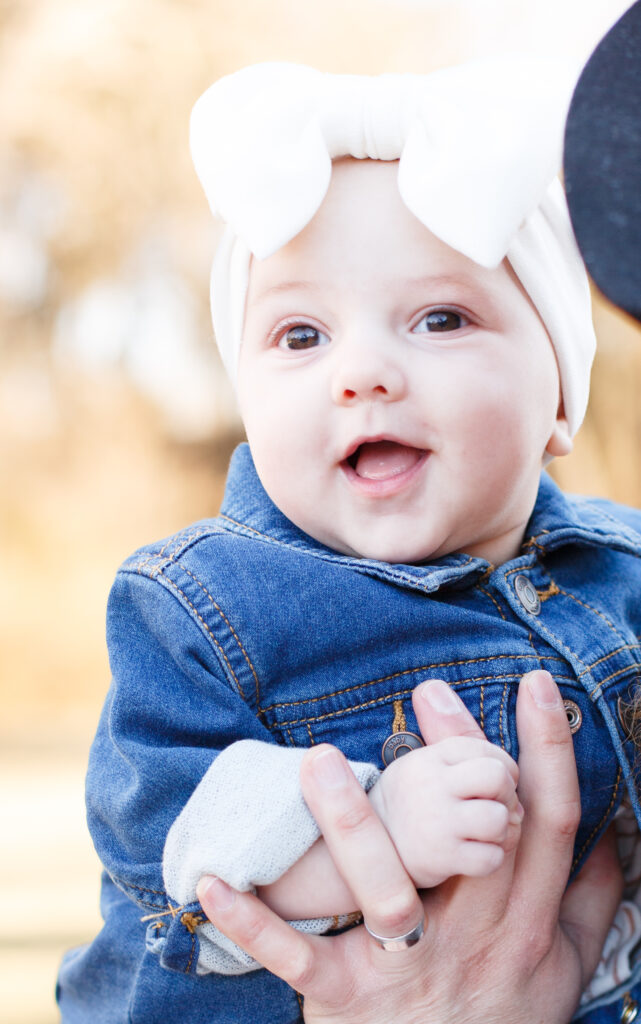 Baby daughter smiles at the camera