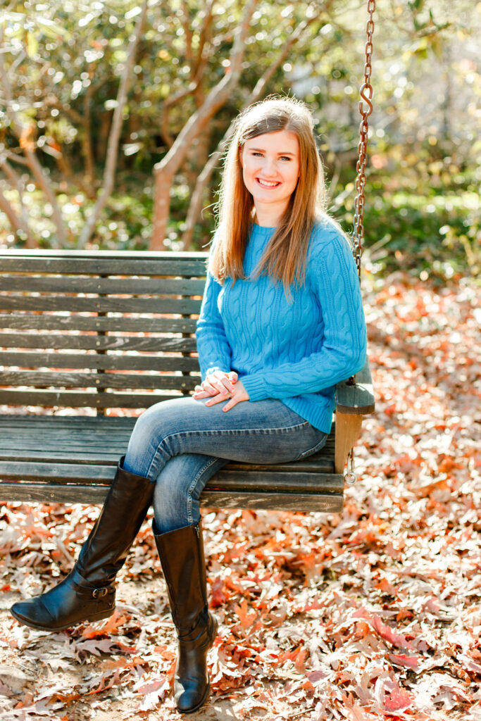 Girl sits on swing