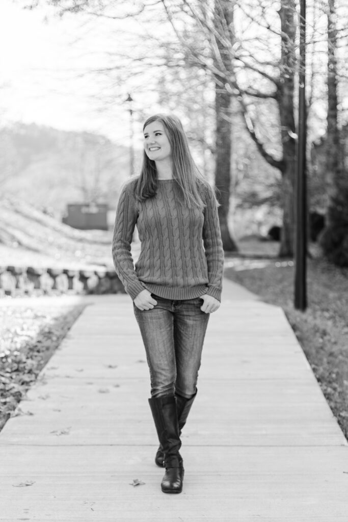 girl happily walks down path