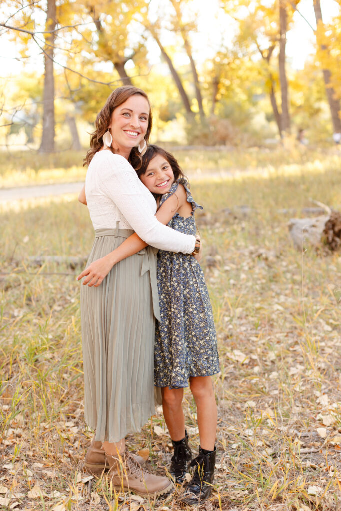 Mom and daughter hug and smile