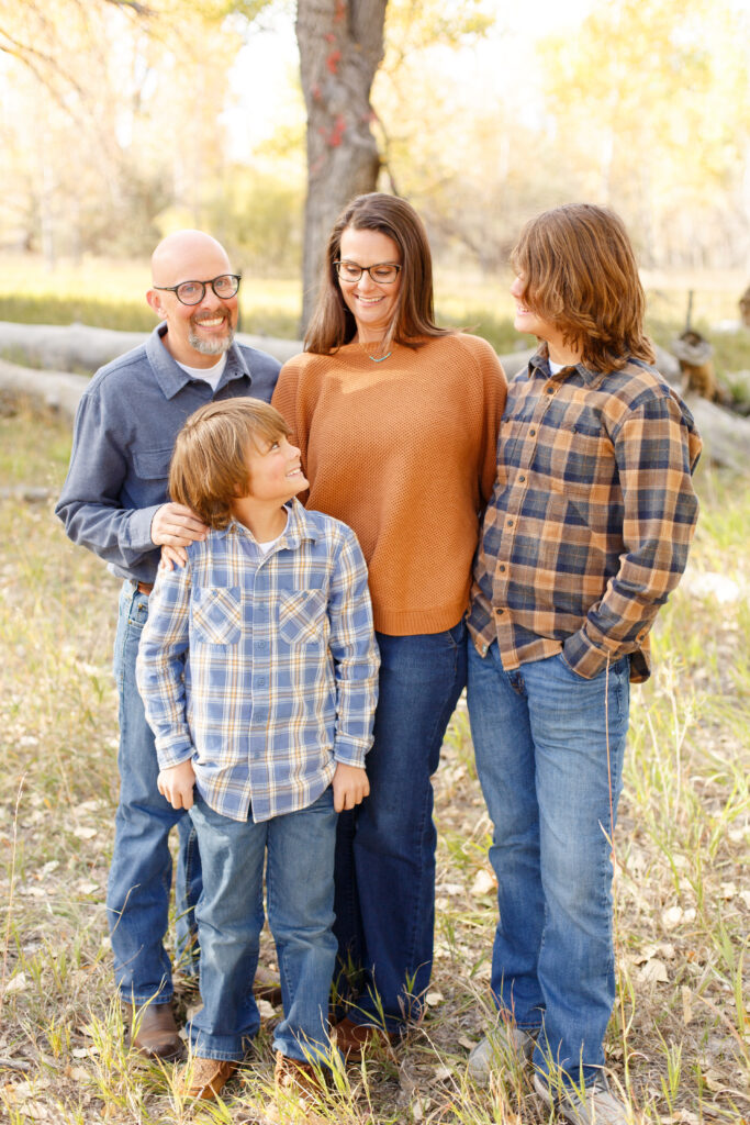 Family laughs together in City Park, Pueblo CO