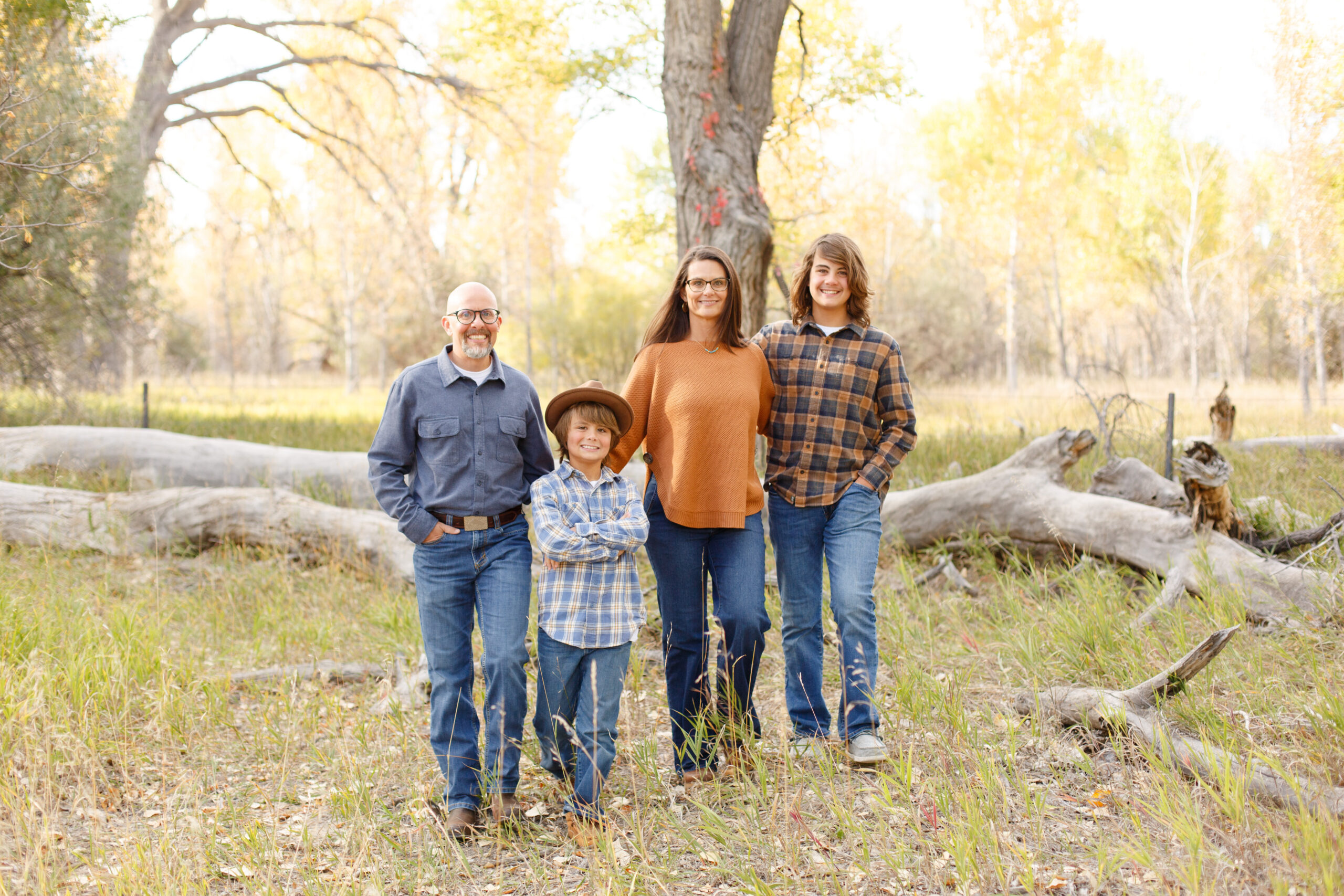 Family happily walks together in City Park, Pueblo CO