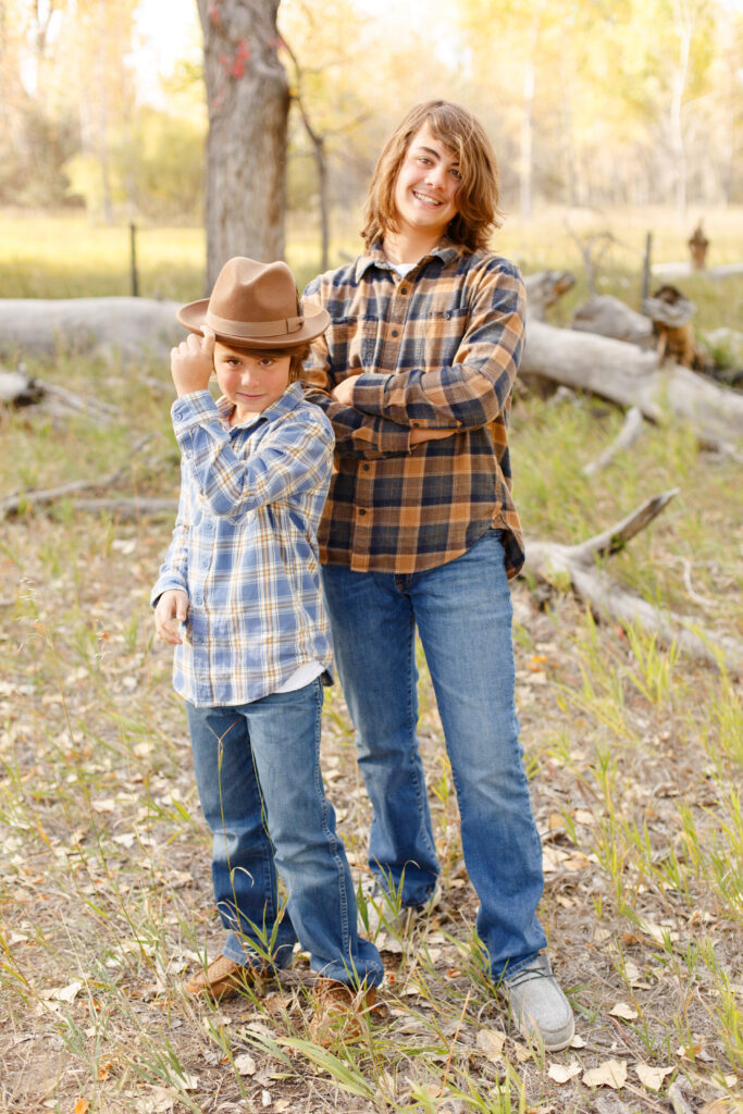 Brothers stand together and cool smile in City Park