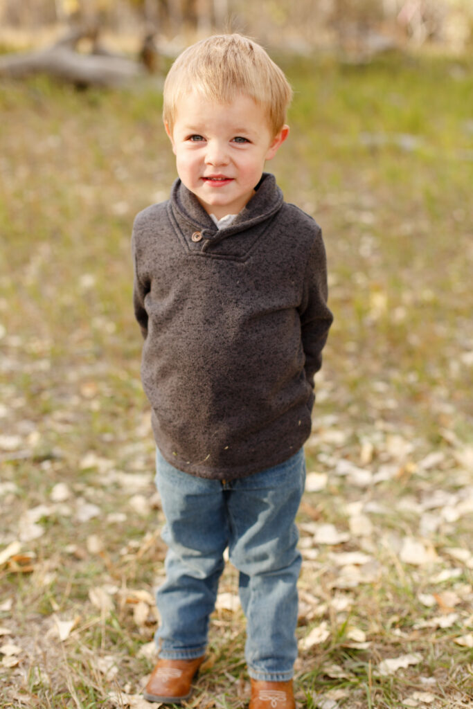 Little boy smiles at camera