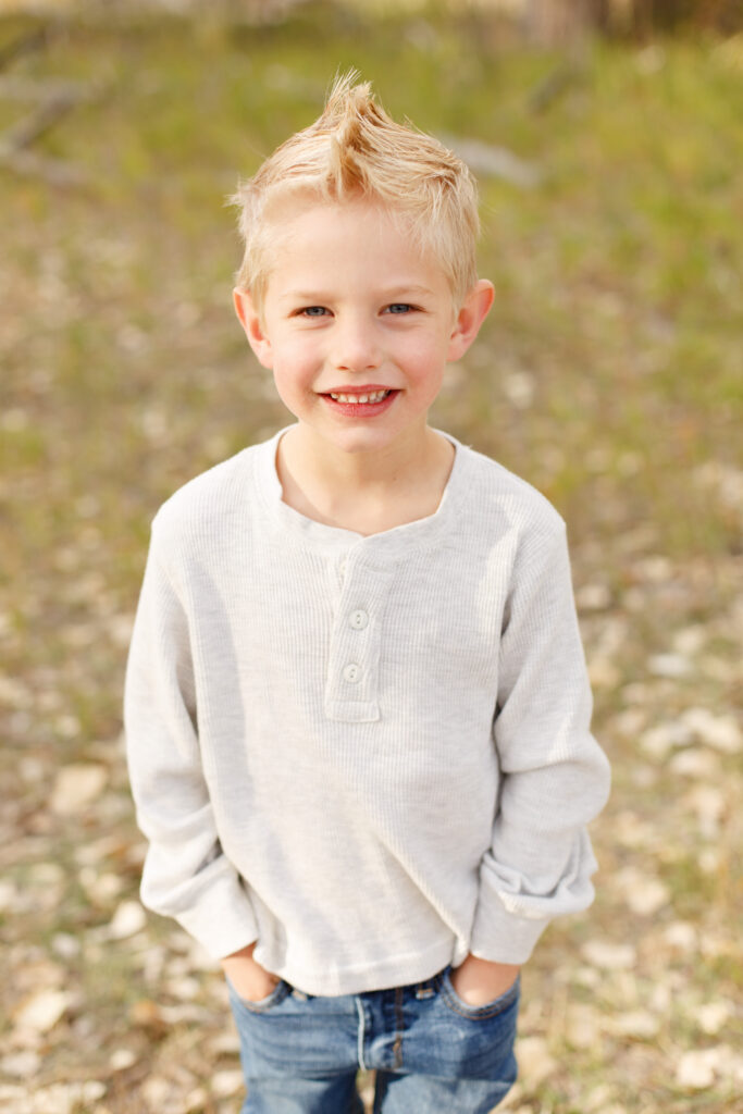 Little boy stand with hands in pockets in Pueblo CO