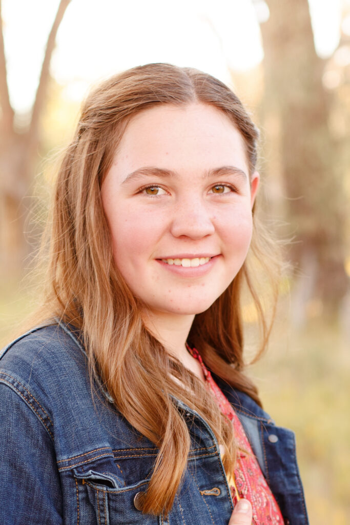 Girl smiles in City Park, Pueblo CO