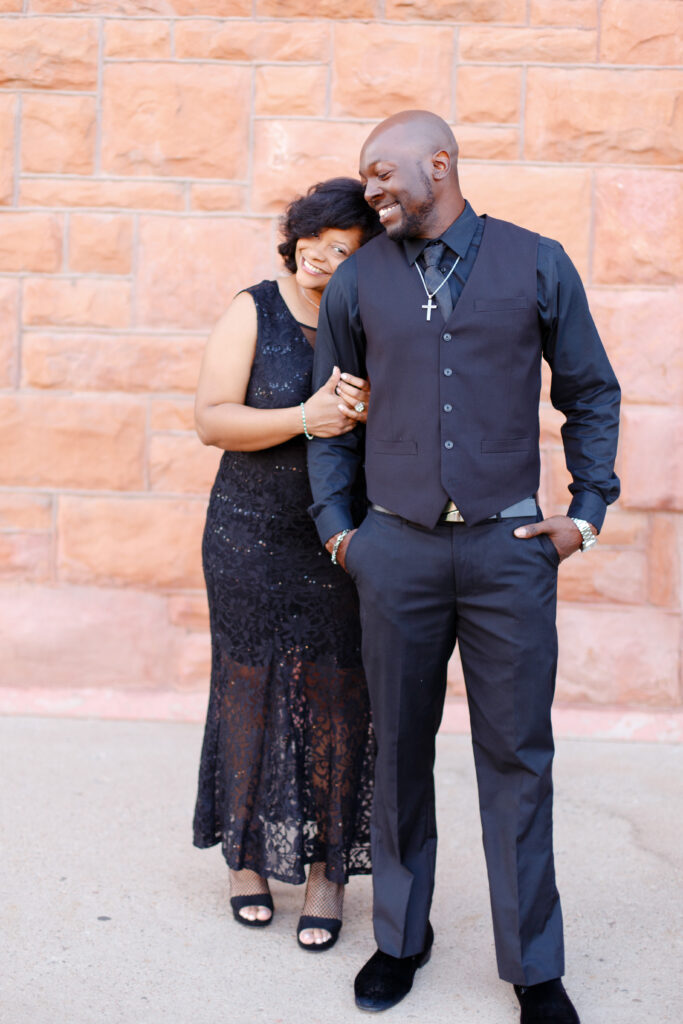 Couple smiles at the Union Depot in Pueblo CO.