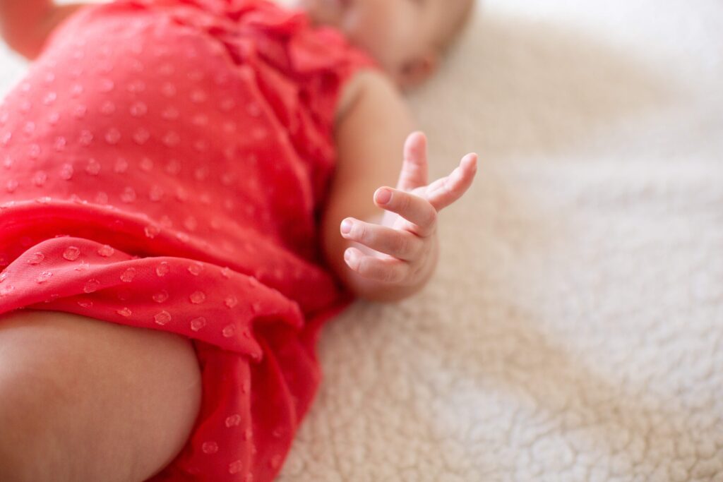 Baby's hand at milestone mirror session in Pueblo West CO