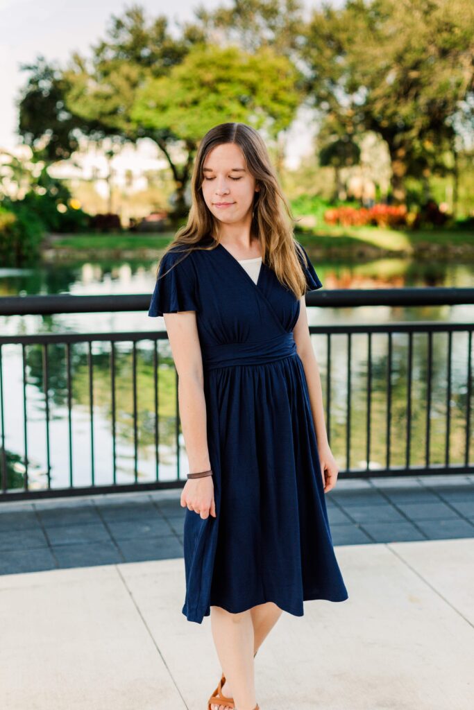 Girl walks toward the camera at beautiful destination session in Orlando Florida.