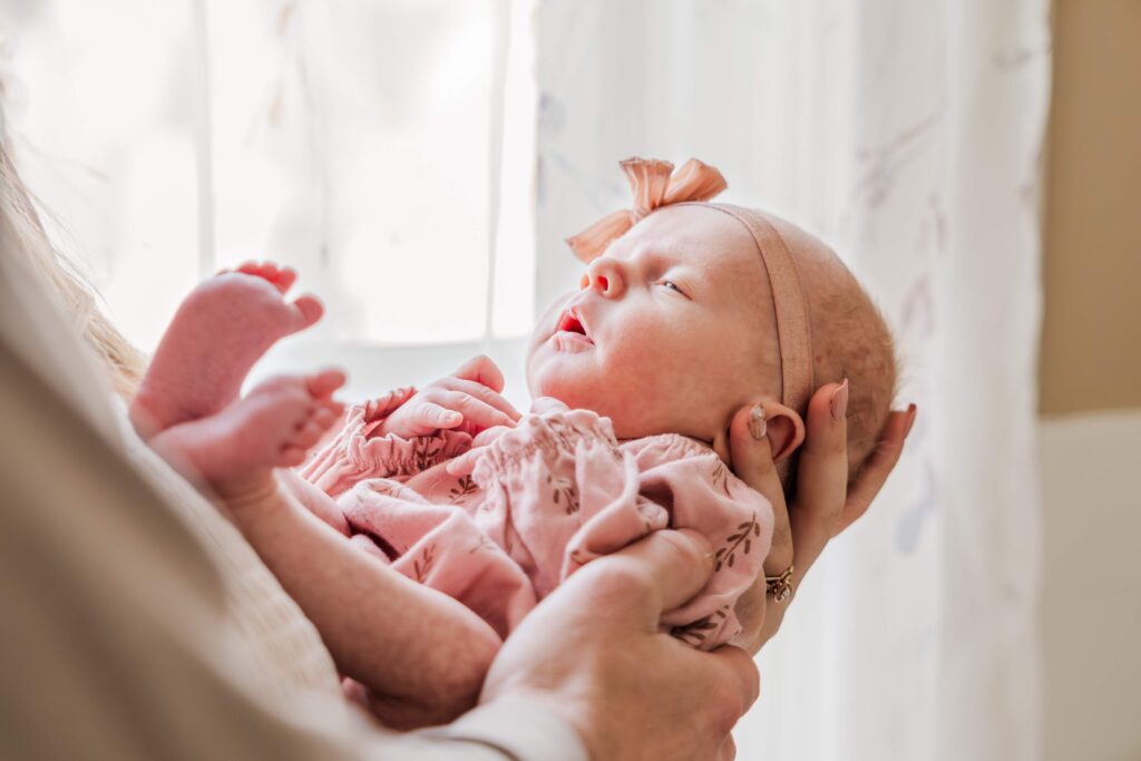 Image of parents holding newborn. 5 simple steps to prepare for your newborn.