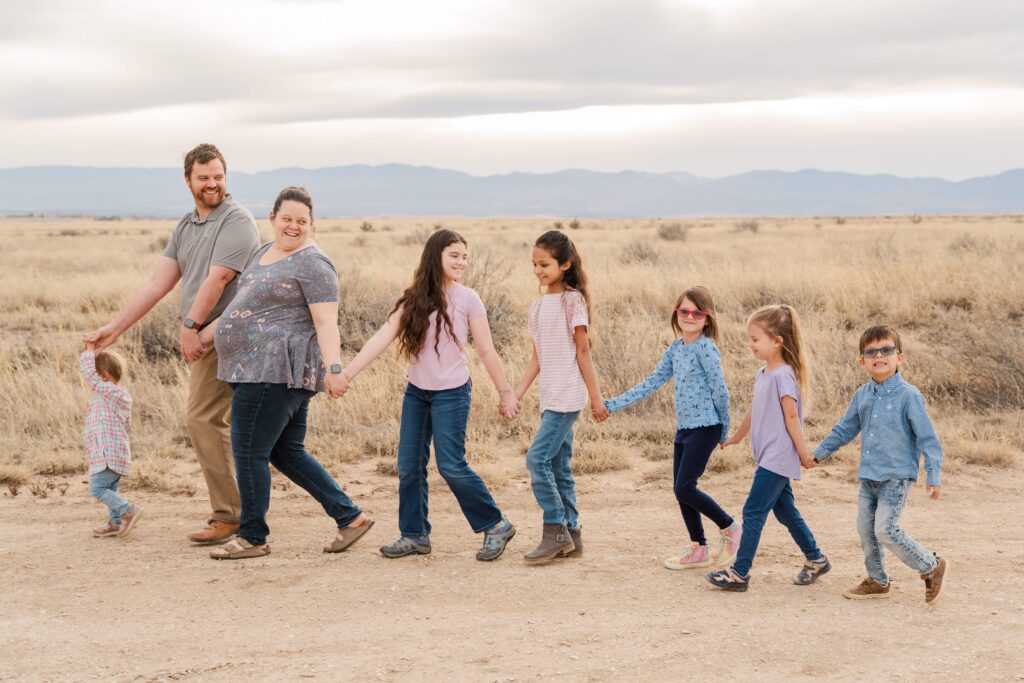 Family walks down a path.