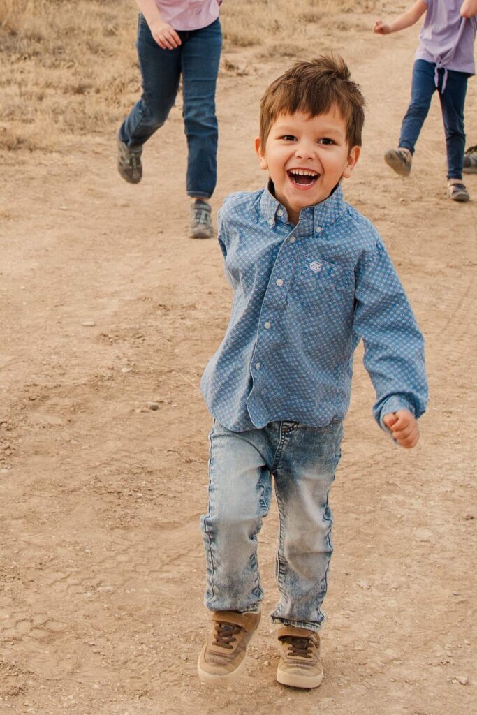 Son smiles while running.