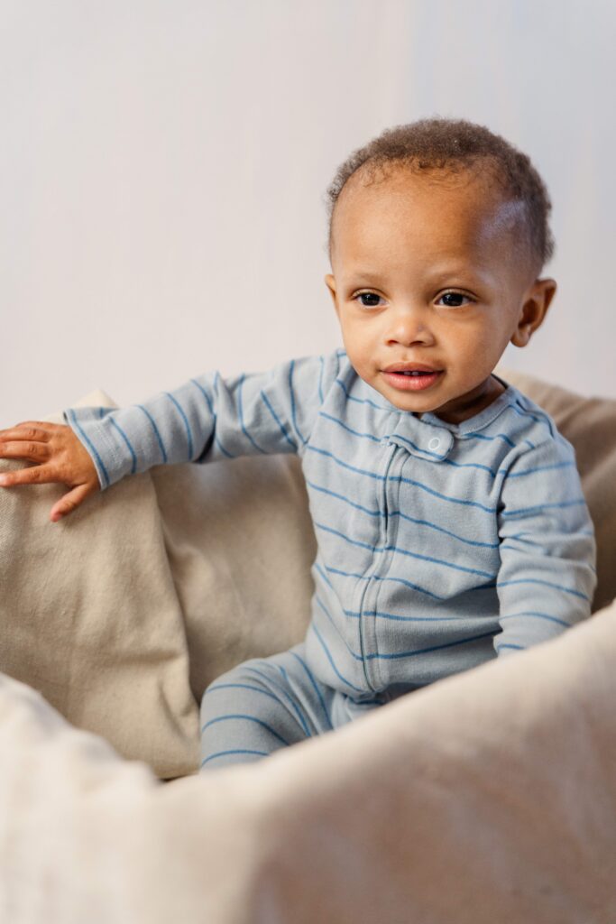 Baby sits in a basket
