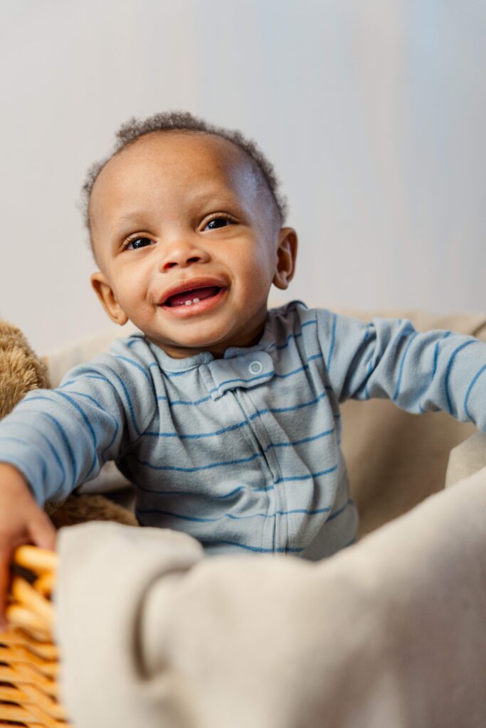 Baby laughs while sitting in basket