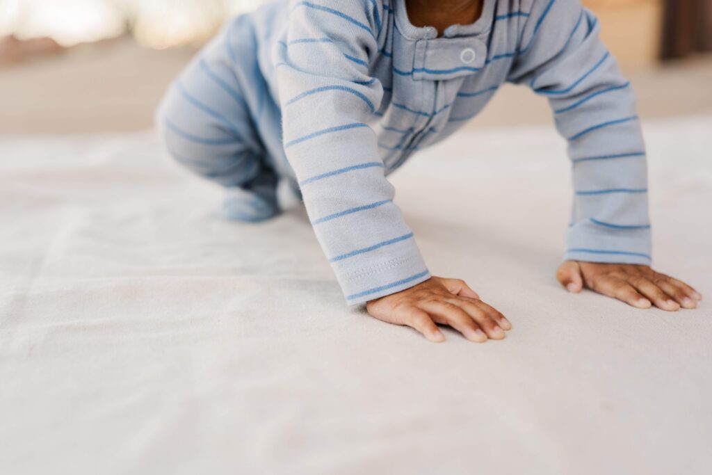 Baby pushes up off the ground
